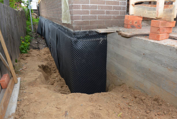 Happy homeowners after waterproofing job in Hawthorne
